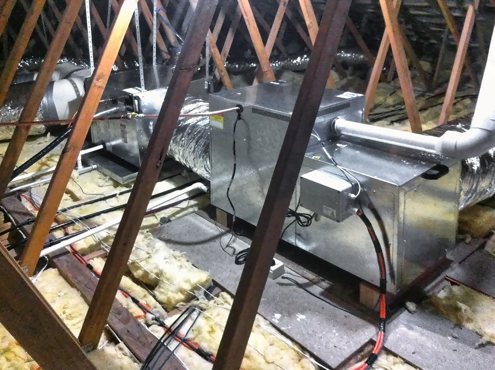 Internal gas ducted heater and insulated ductwork installed in a roof space