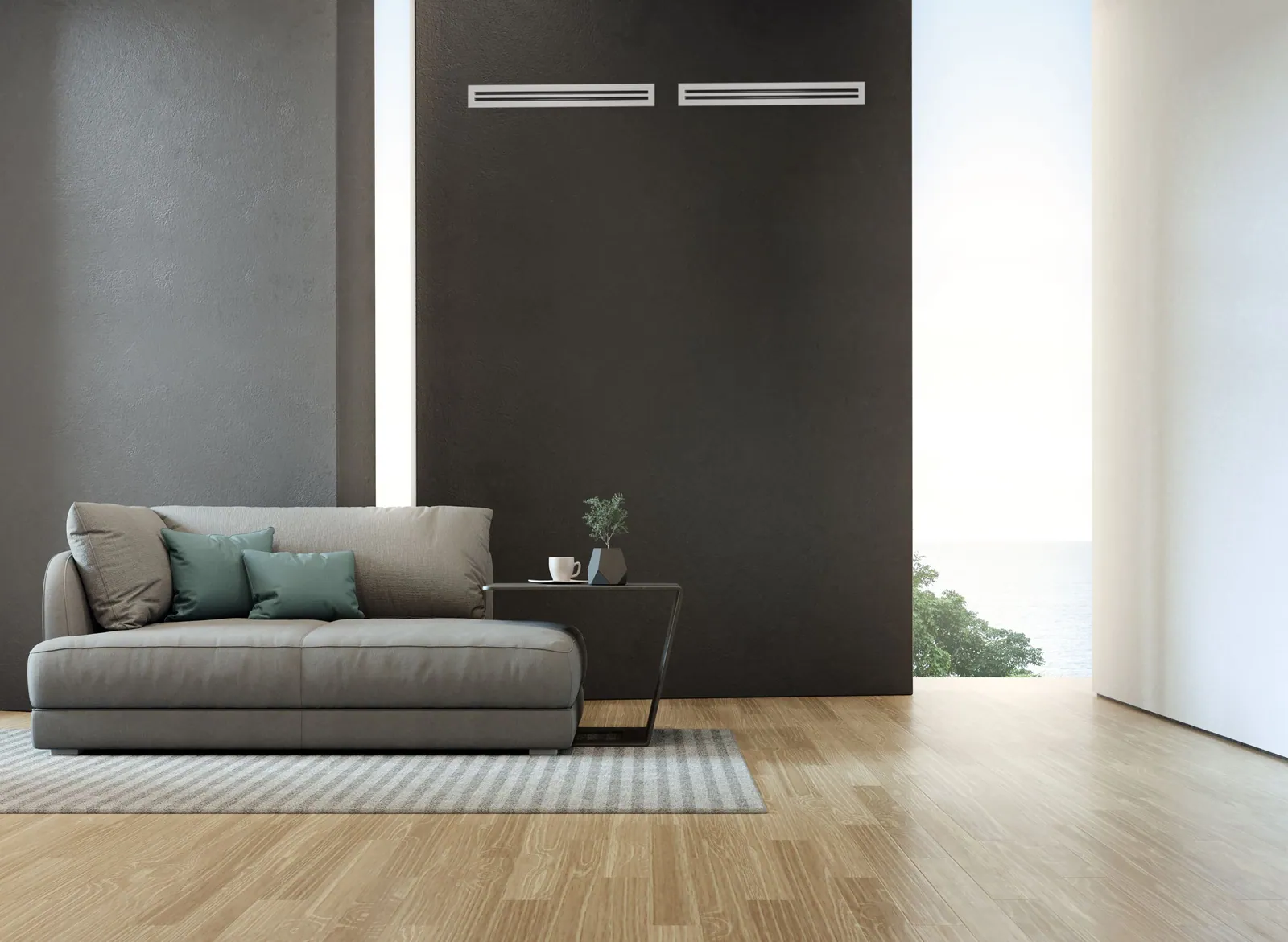 Family room with a slim ceiling outlet from a Rinnai ducted reverse cycle system above the sofa