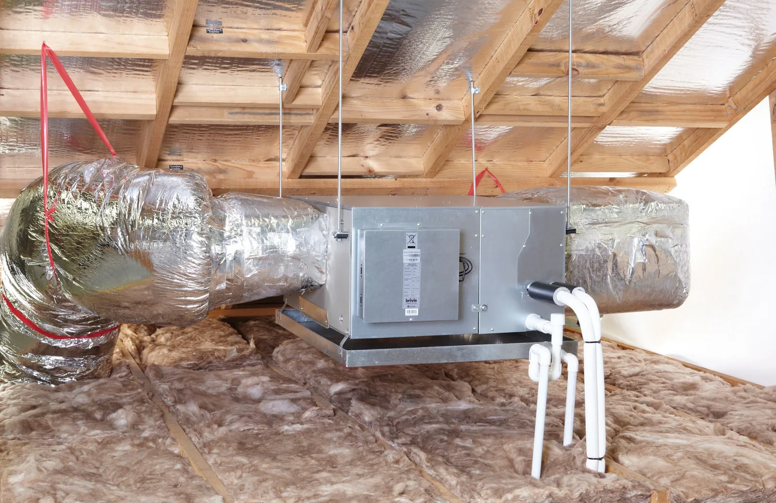 Rinnai ducted reverse cycle indoor fan coil unit installed in a roof space with insulated ducts attached