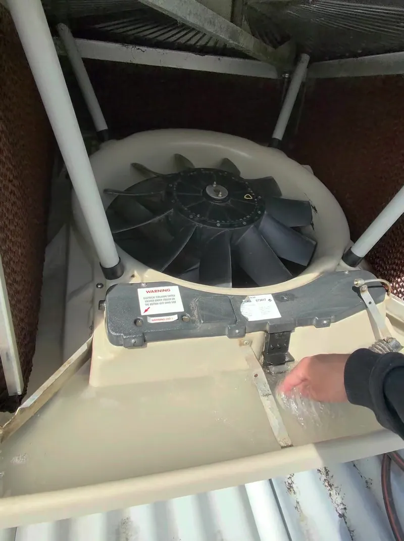 Close-up of blocked, dirty evaporative cooler pads before cleaning