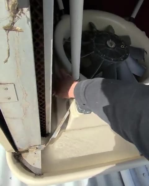 Clean: cleaning the inside of an evaporative cooler during one of our services
